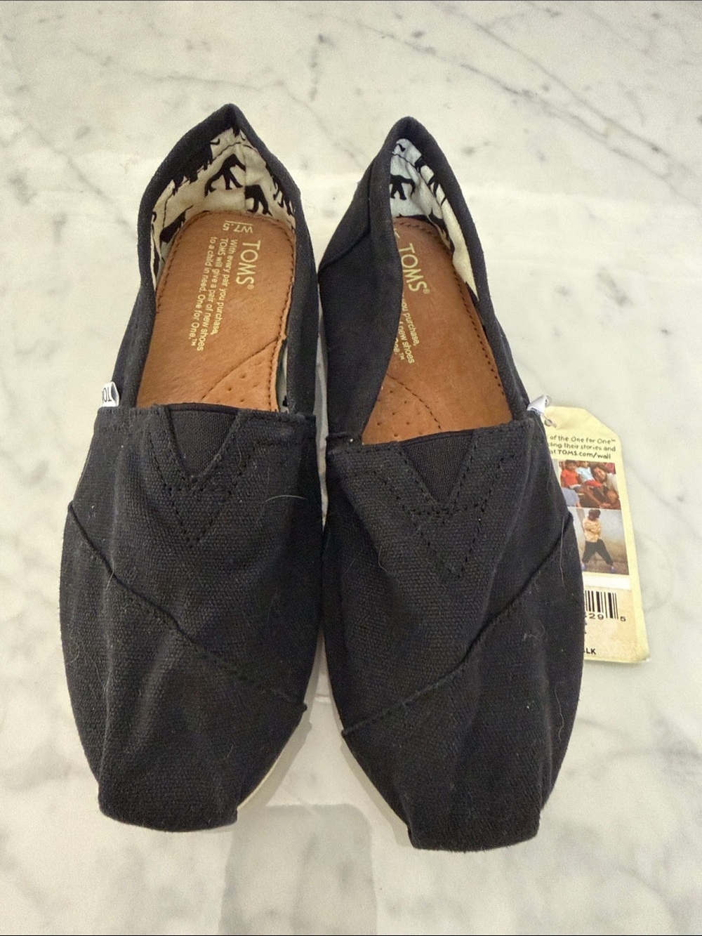 Toms Black Canvas Women’s Slip-On Loafers